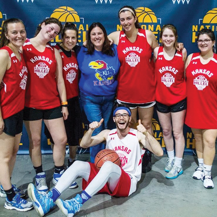 The Women’s Hoops Classic supports a variety of KU Hillel programs including ‘Jewball,’ where dozens of students gather every Friday for a friendly game of pre-Shabbat pick-up basketball. Last year these players, and KU Hillel Executive Director Suzy Sostrin (standing, wearing KU sweatshirt), attended the National Hillel Basketball Tournament hosted at the University of Maryland.