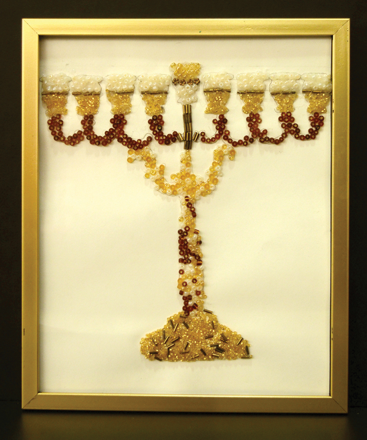 Sisters Noya and Aviya Matta designed and crafted this beaded and framed hanukkiah.