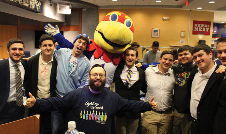 Rabbi Zalman Ticehtel (kneeling) interacts often with the members of KU’s two Jewish fraternities. Here he is with the freshmen of Alpha Epsilon Pi fraternity.