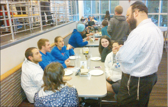SOLD OUT! Rabbi Zalman Tiechtel said he and KU Dining Services underestimated the number of ‘Jewhawks’ that would be interested in purchasing a kosher meal at Mrs. E’s Dining Center. The kosher dinner was sold out Monday night long before the event was over. Rabbi Tiechtel sends his apologies to those who came and missed out. ‘Next week we will be back, bigger and better!’ Shown are some of the 50 people who did enjoy a kosher meal on the Hill Monday night.