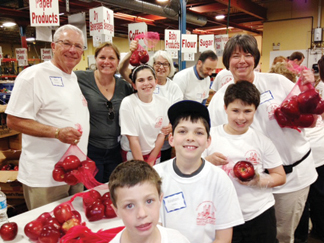 The Temple, Congregation B’nai Jehudah had its annual Mitzvah Day Sunday, May 4. Reports are the event was ‘amazing with an incredible turnout of more than 500 people.’ Patricia Werthan Uhlman (far right, holding bag of apples) enjoyed her time volunteering at Harvesters so much she sent us this photo of the Davidow, Lewis, Shaw and Uhlmann families.